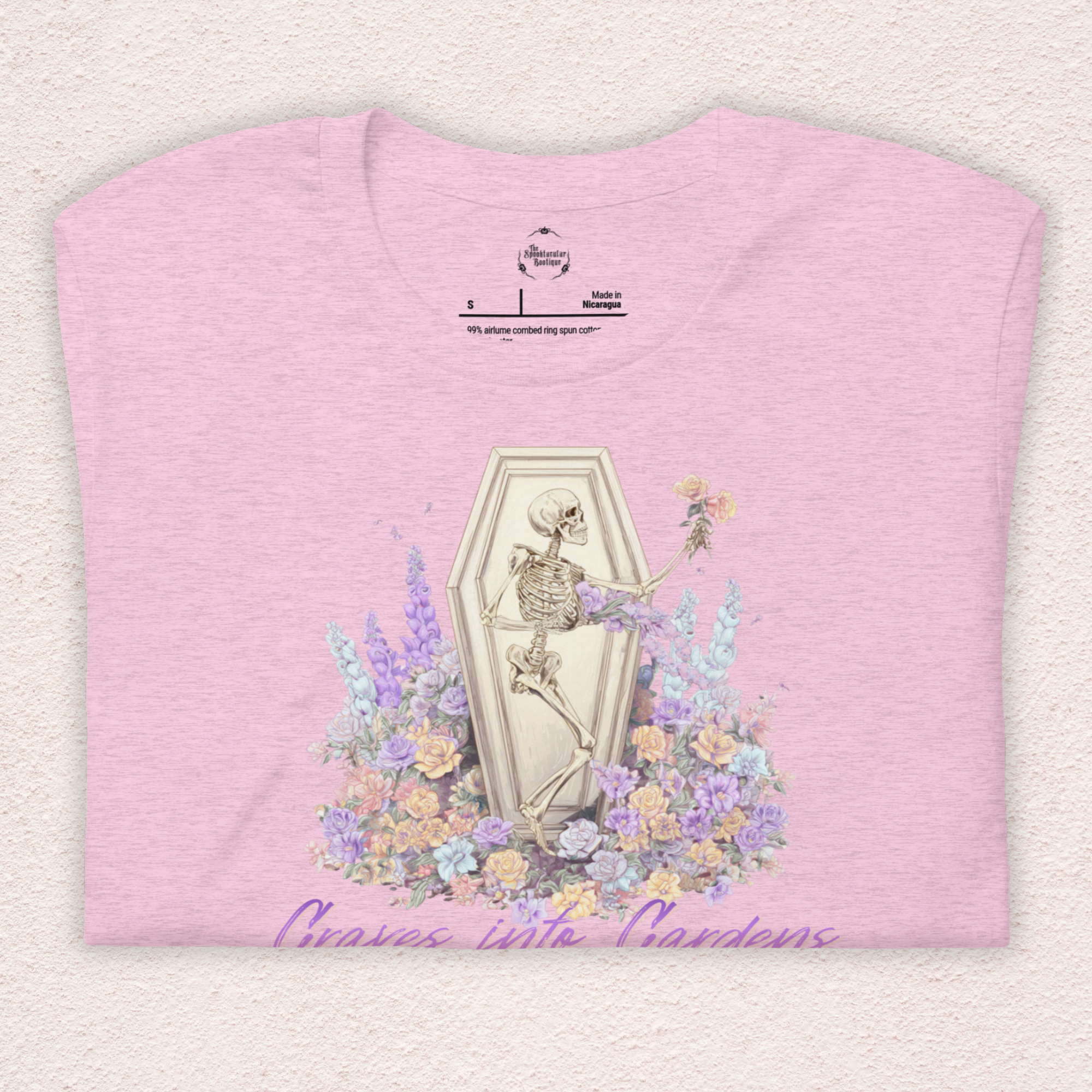 Graves Into Gardens Skeleton Easter Tee | Gothic Faith Spring Shirt | Pastel Floral Resurrection Graphic | Spooky Christian Bella Canvas T-Shirt