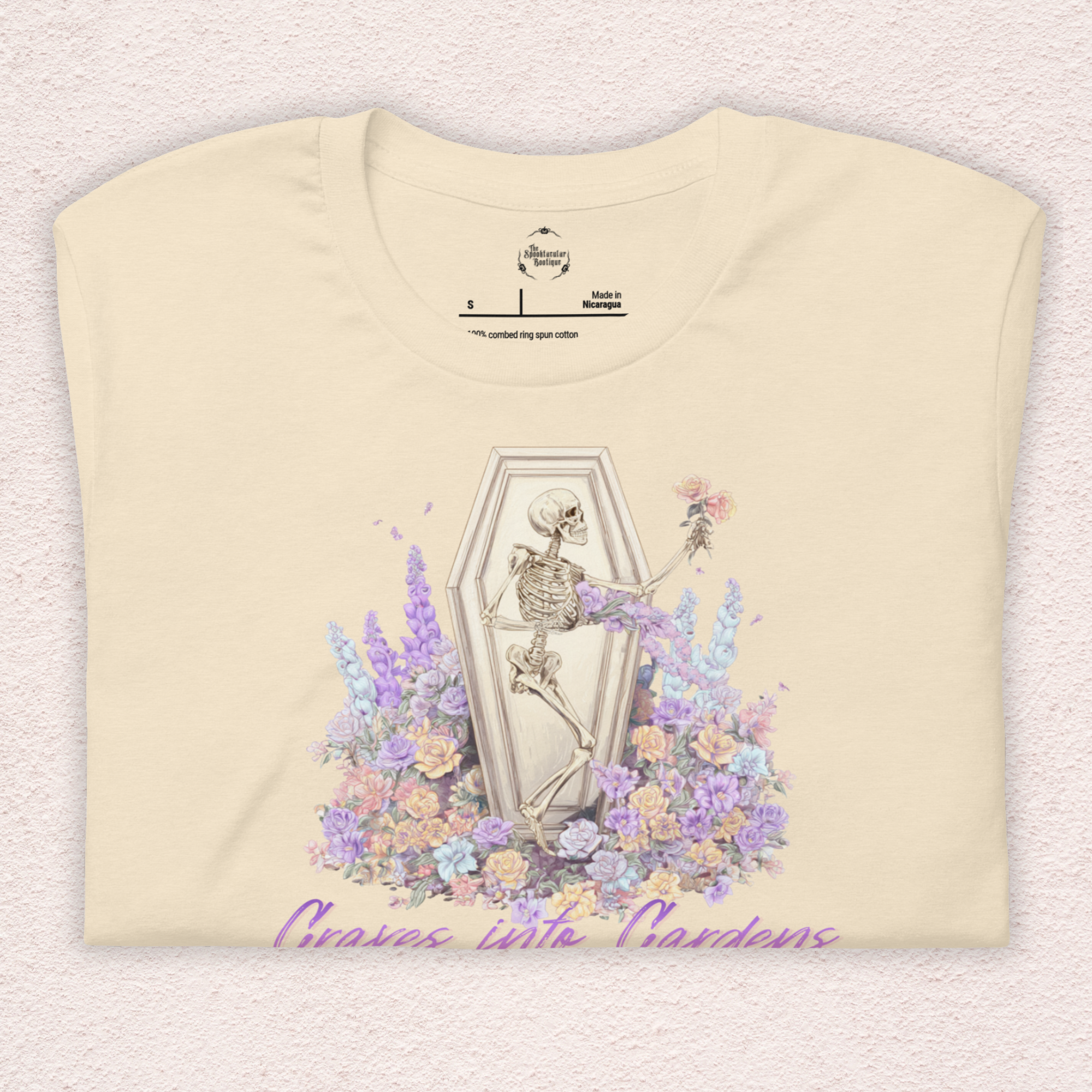 Graves Into Gardens Skeleton Easter Tee | Gothic Faith Spring Shirt | Pastel Floral Resurrection Graphic | Spooky Christian Bella Canvas T-Shirt