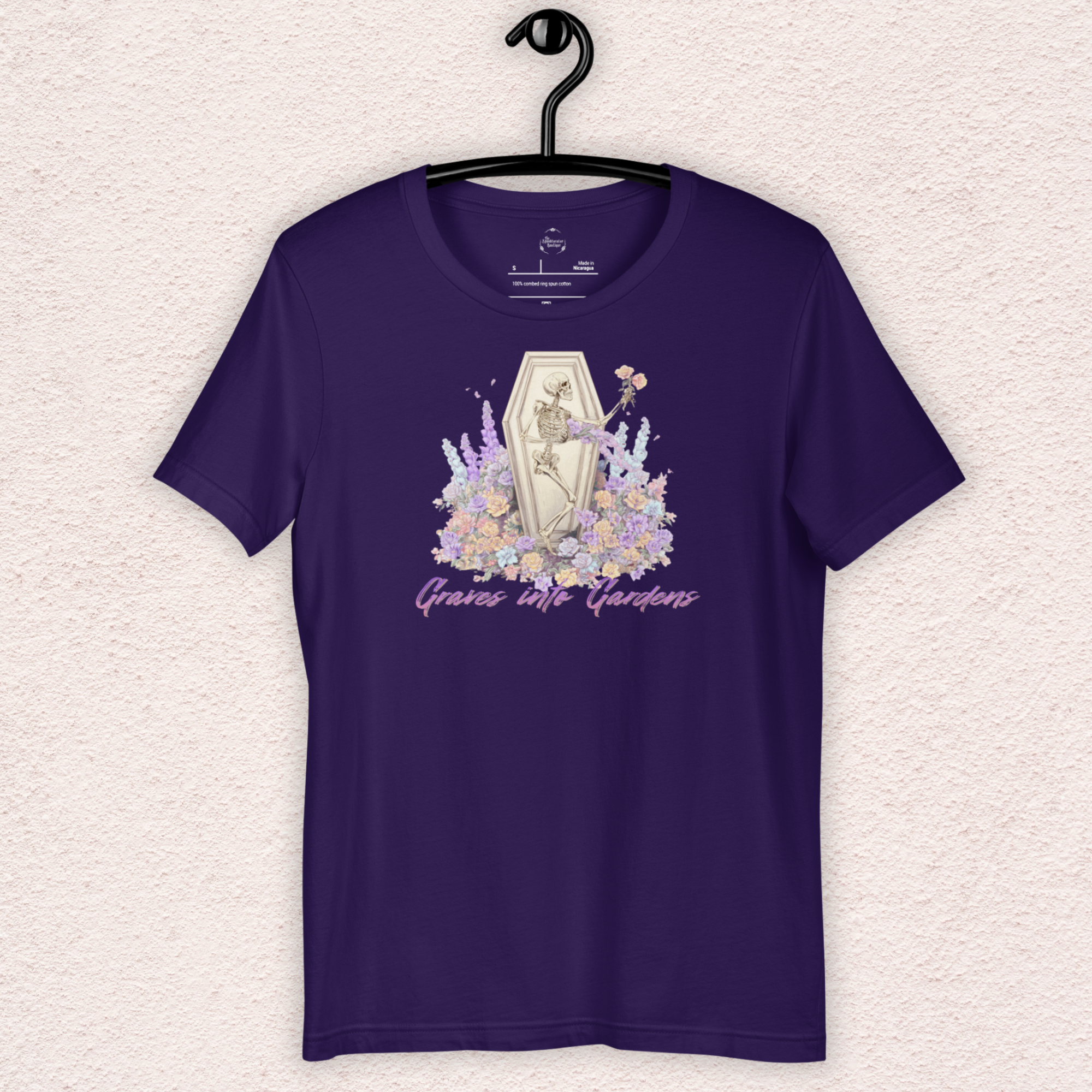 Graves Into Gardens Skeleton Easter Tee | Gothic Faith Spring Shirt | Pastel Floral Resurrection Graphic | Spooky Christian Bella Canvas T-Shirt