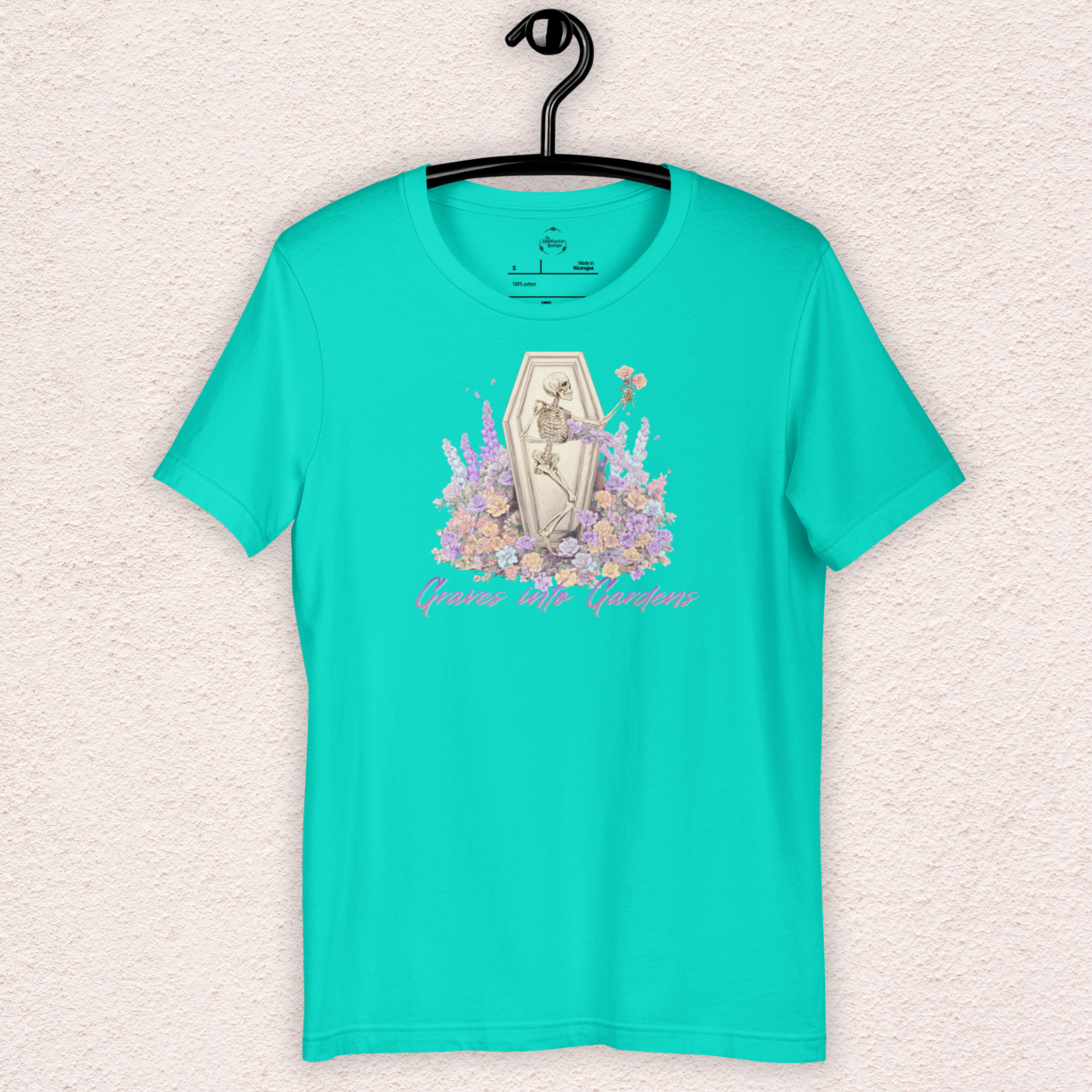 Graves Into Gardens Skeleton Easter Tee | Gothic Faith Spring Shirt | Pastel Floral Resurrection Graphic | Spooky Christian Bella Canvas T-Shirt