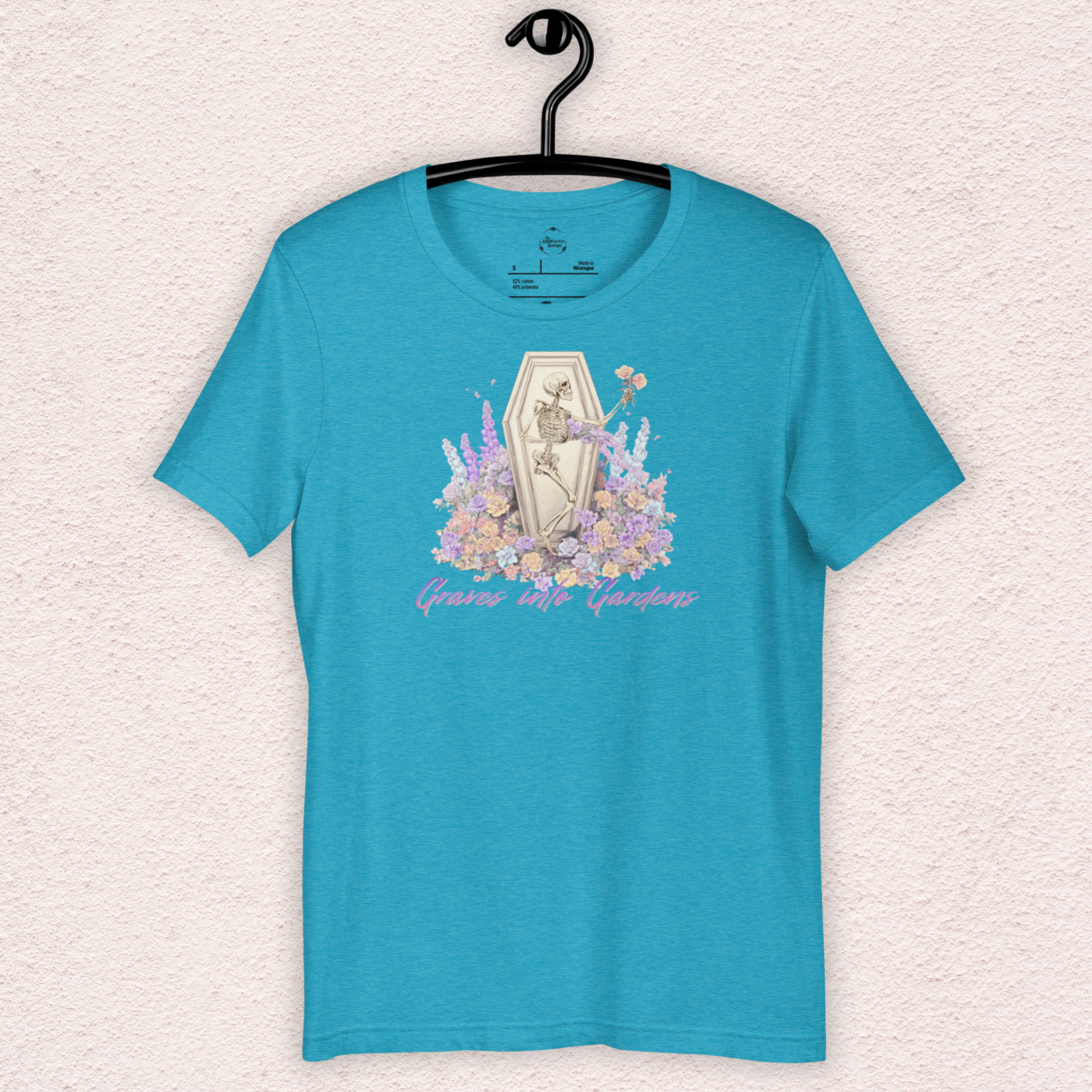 Graves Into Gardens Skeleton Easter Tee | Gothic Faith Spring Shirt | Pastel Floral Resurrection Graphic | Spooky Christian Bella Canvas T-Shirt