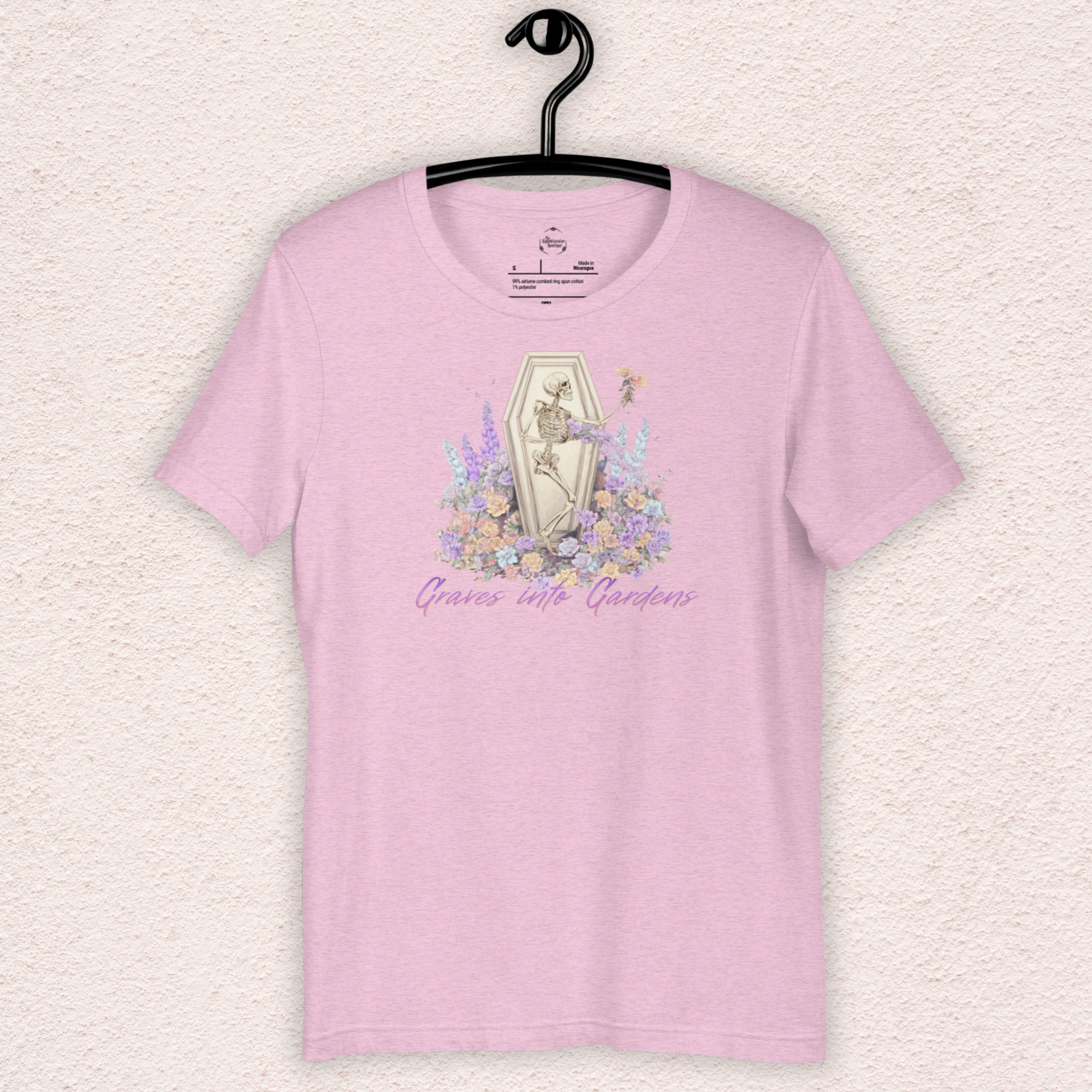 Graves Into Gardens Skeleton Easter Tee | Gothic Faith Spring Shirt | Pastel Floral Resurrection Graphic | Spooky Christian Bella Canvas T-Shirt