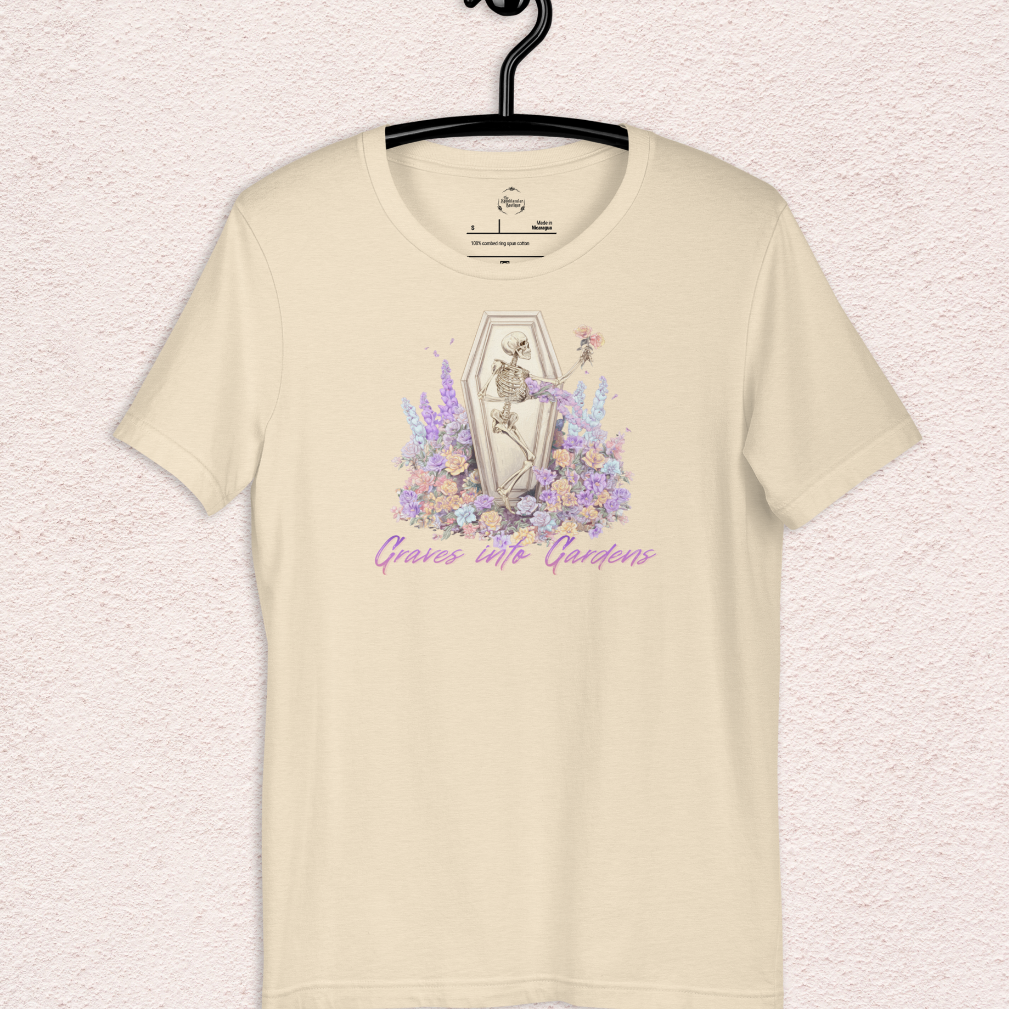 Graves Into Gardens Skeleton Easter Tee | Gothic Faith Spring Shirt | Pastel Floral Resurrection Graphic | Spooky Christian Bella Canvas T-Shirt